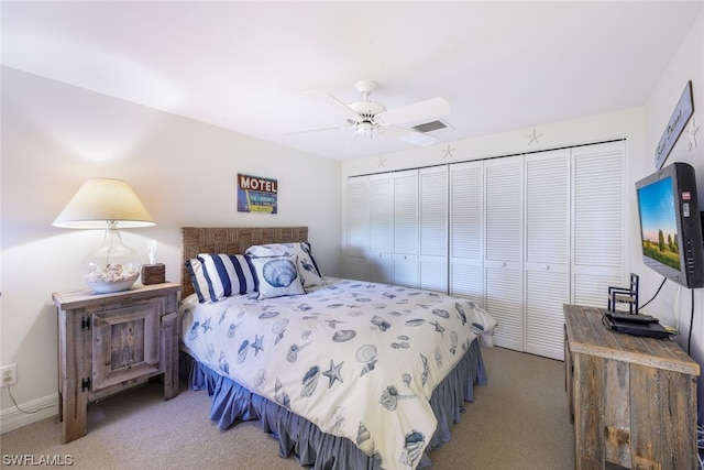 bedroom featuring a closet, light carpet, and ceiling fan