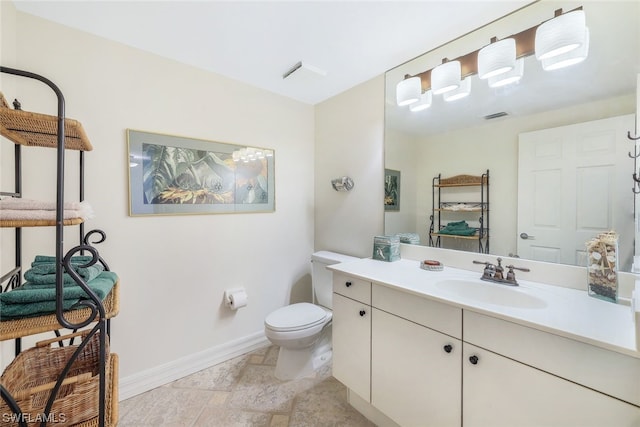 bathroom with oversized vanity, toilet, and tile floors