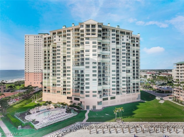 view of building exterior with a water view