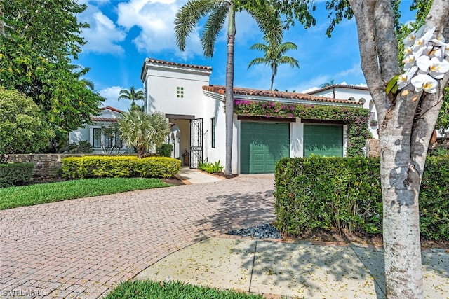 mediterranean / spanish-style house featuring a garage