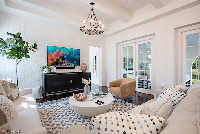 living room with wood-type flooring, french doors, beamed ceiling, and plenty of natural light