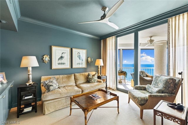 living room featuring light carpet, a water view, ornamental molding, and ceiling fan