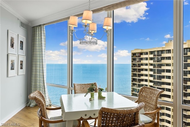 interior space with a water view and an inviting chandelier