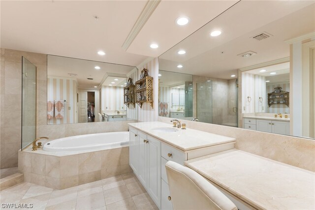 bathroom with tile floors, vanity with extensive cabinet space, and plus walk in shower