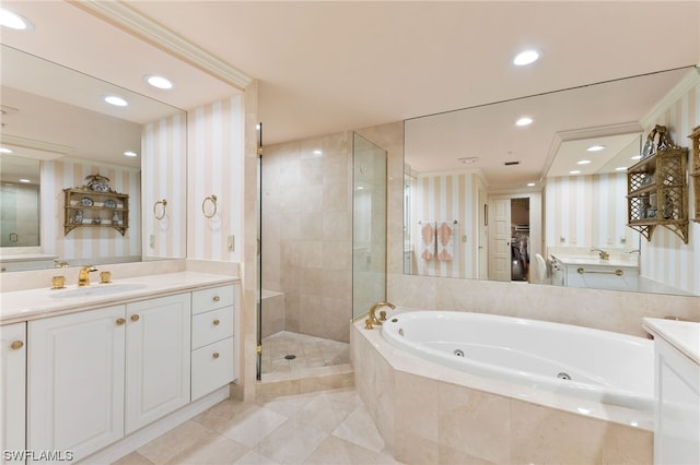 bathroom featuring separate shower and tub, vanity, and tile flooring