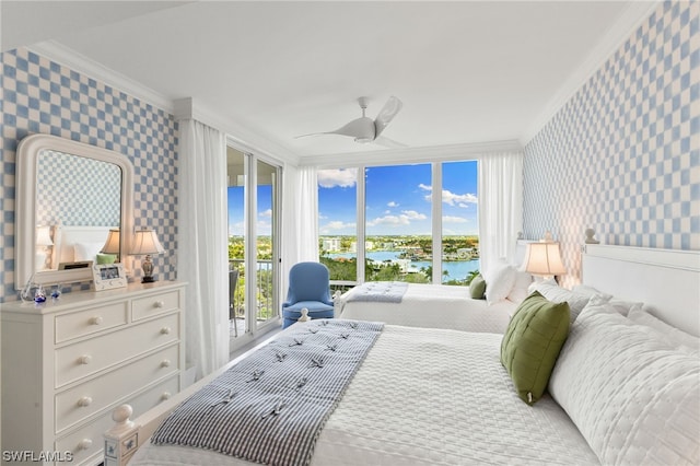 bedroom featuring multiple windows, crown molding, ceiling fan, and a water view