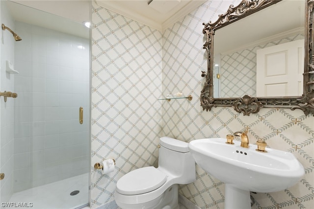 bathroom with toilet, a shower with door, ornamental molding, and tile walls