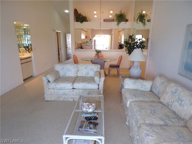 carpeted living room featuring high vaulted ceiling