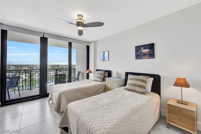 bedroom with tile floors, ceiling fan, access to exterior, and a wall of windows