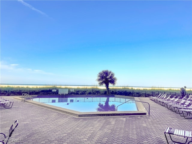 view of swimming pool with a patio area