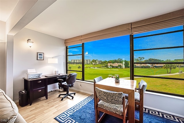 office area with golf simulator and light hardwood / wood-style floors