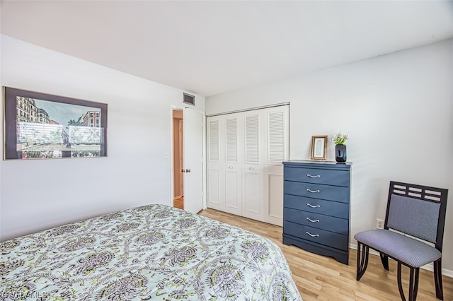 bedroom with a closet and light wood-type flooring