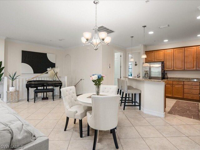 tiled dining room with crown molding and an inviting chandelier