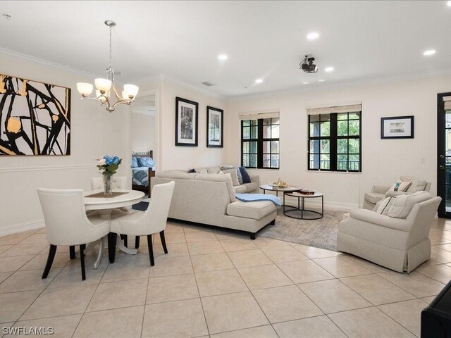 dining space with a chandelier, crown molding, and light tile floors