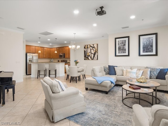 living room featuring an inviting chandelier, light tile patterned floors, and ornamental molding