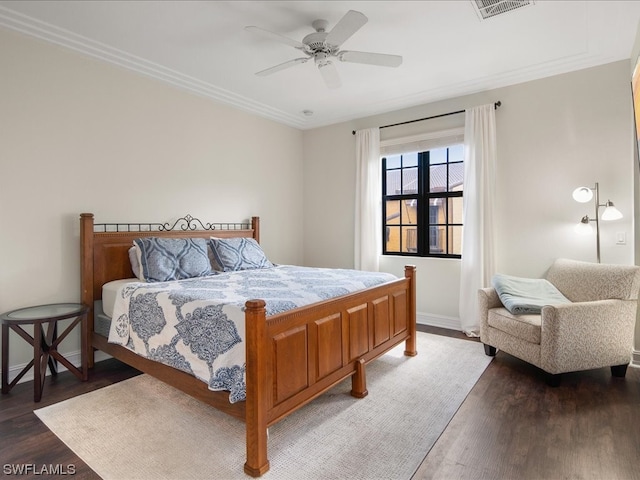 bedroom featuring crown molding, dark hardwood / wood-style flooring, and ceiling fan