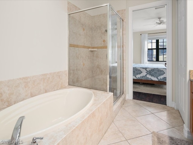 bathroom featuring ceiling fan, tile flooring, and independent shower and bath