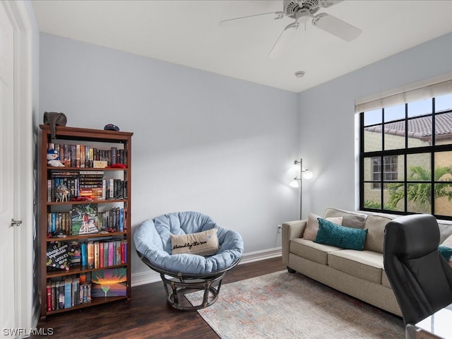 interior space with dark wood-type flooring and ceiling fan