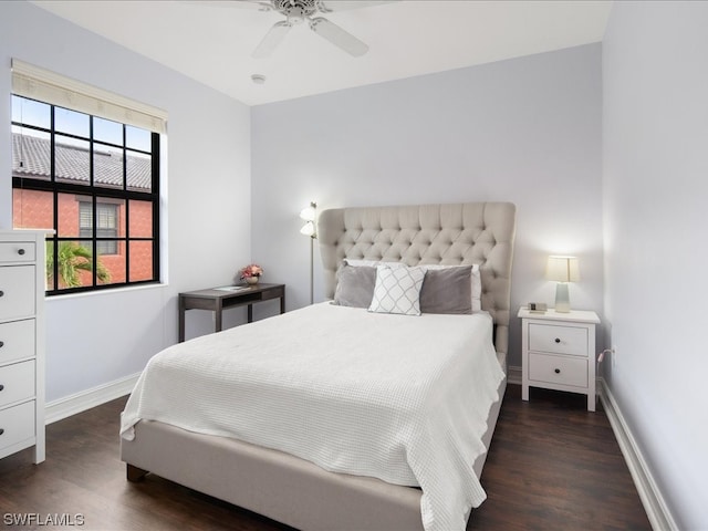 bedroom with ceiling fan and dark wood-type flooring