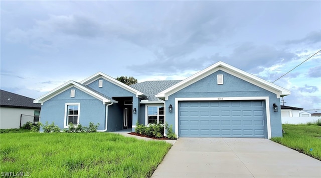 view of front of home featuring a front lawn and a garage