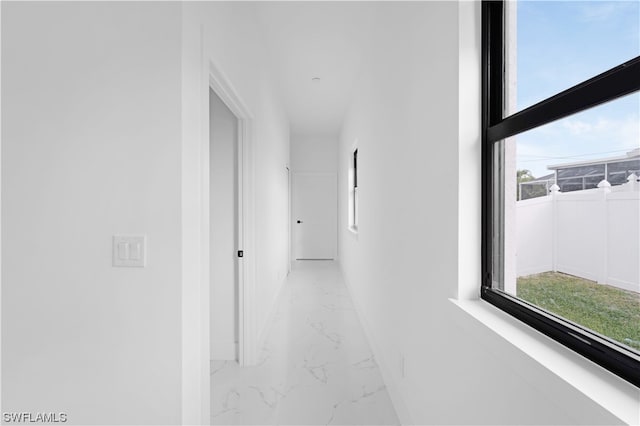 hall featuring light tile floors