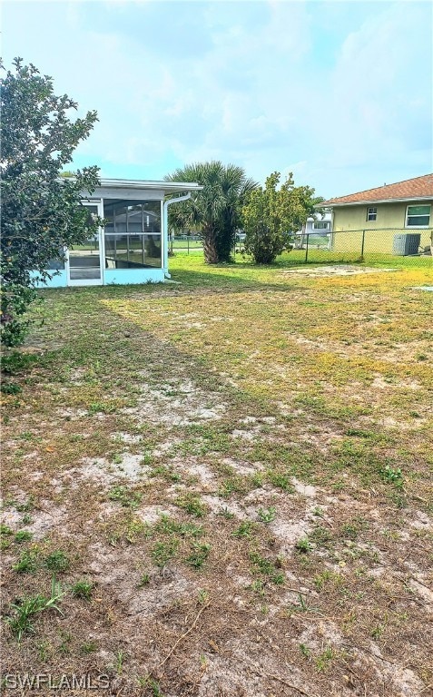 view of yard featuring a sunroom