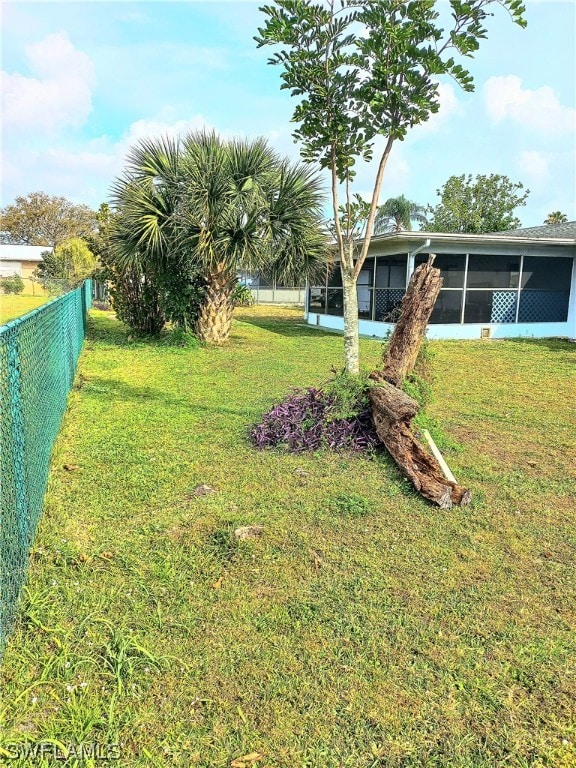 view of yard featuring a sunroom