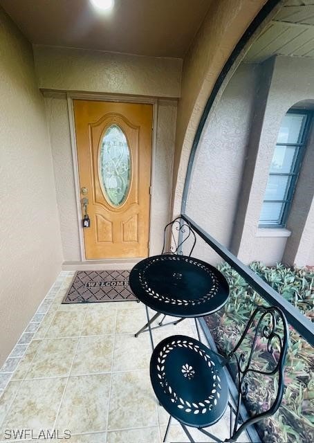 entrance to property with a balcony