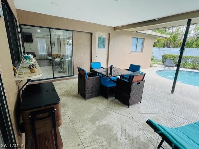 view of patio / terrace featuring a fenced in pool