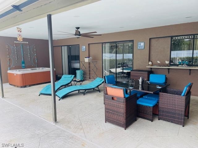 view of terrace featuring ceiling fan