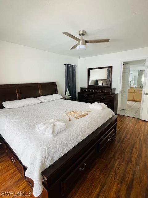 bedroom with connected bathroom, ceiling fan, and light hardwood / wood-style flooring