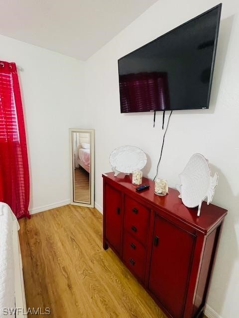 bedroom with light wood-type flooring