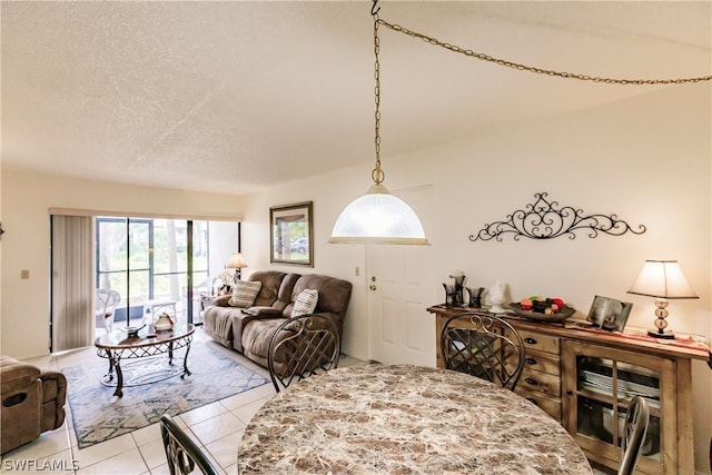 living room with tile floors and a textured ceiling