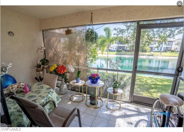 sunroom with a water view