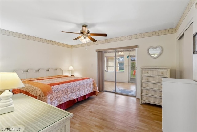 bedroom with ceiling fan, access to exterior, and hardwood / wood-style flooring