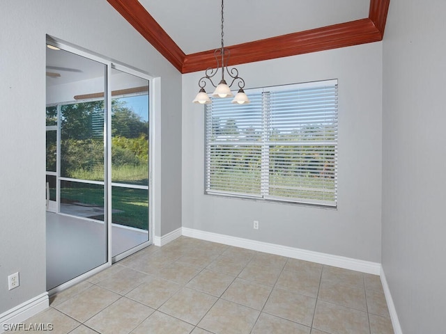 tiled empty room with vaulted ceiling, a notable chandelier, and crown molding