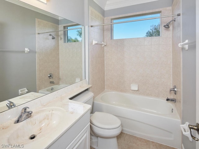 full bathroom featuring toilet, ornamental molding, tiled shower / bath, tile floors, and vanity