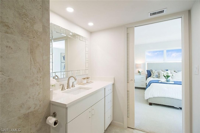 bathroom featuring recessed lighting, visible vents, connected bathroom, and vanity