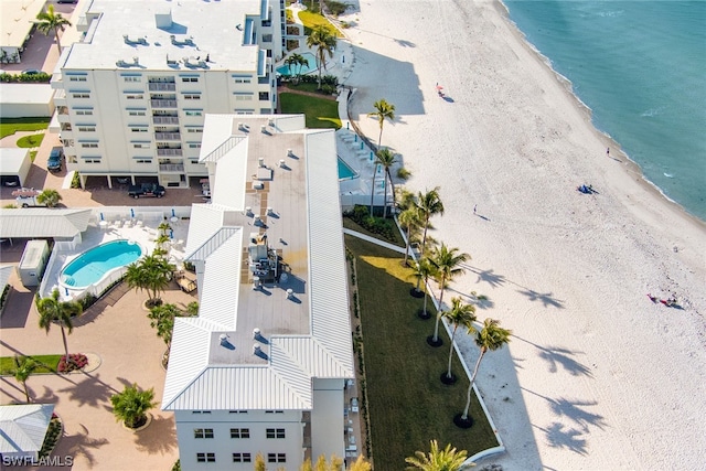 bird's eye view featuring a water view and a beach view