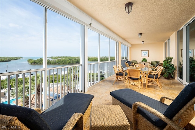 sunroom with a water view