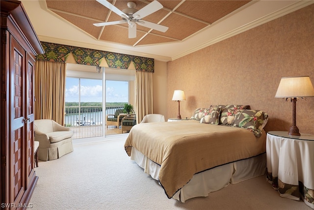 carpeted bedroom featuring access to outside, ceiling fan, lofted ceiling, a water view, and ornamental molding