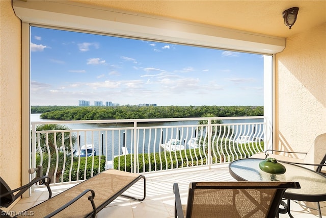 balcony featuring a water view