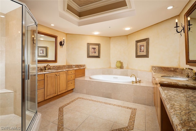 bathroom with tile patterned floors, separate shower and tub, a tray ceiling, crown molding, and vanity