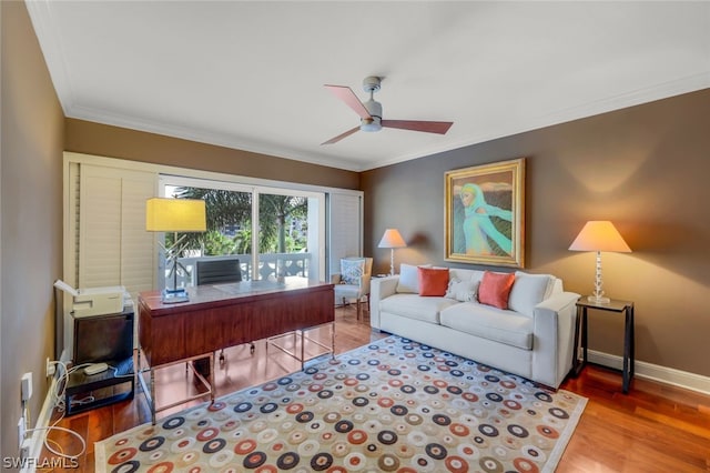 office space with hardwood / wood-style flooring, crown molding, and ceiling fan