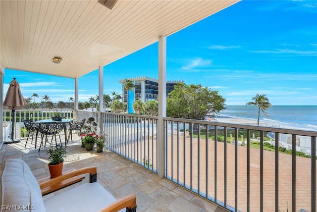 balcony with a view of the beach and a water view