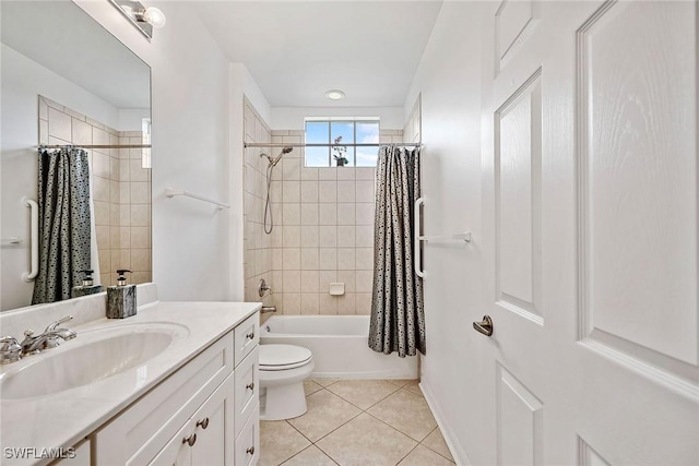 full bathroom with tile patterned floors, shower / tub combo with curtain, vanity, and toilet