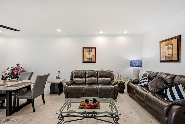 living room featuring light tile patterned floors and crown molding