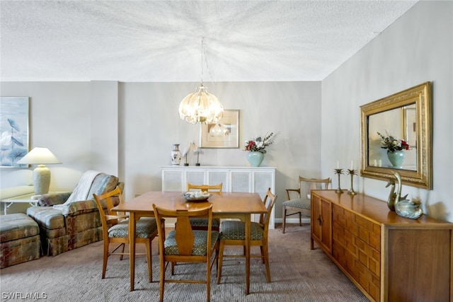 carpeted dining area featuring a notable chandelier and a textured ceiling