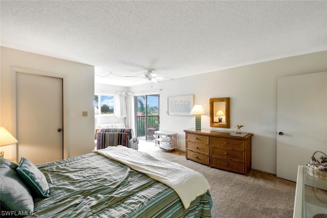 bedroom with ceiling fan, a textured ceiling, light colored carpet, and access to exterior