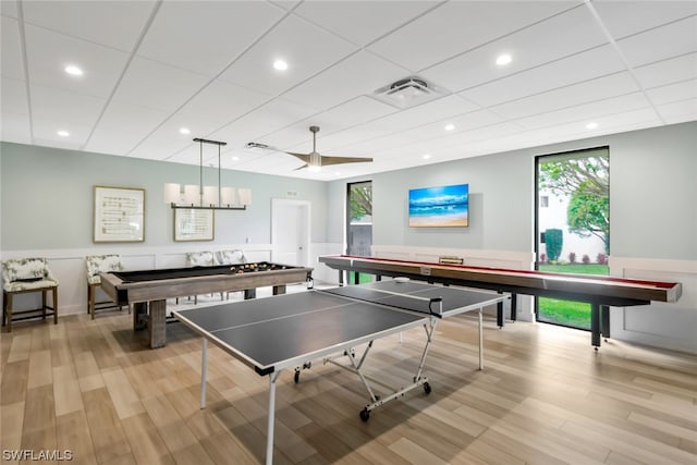 rec room featuring a paneled ceiling and light wood-type flooring